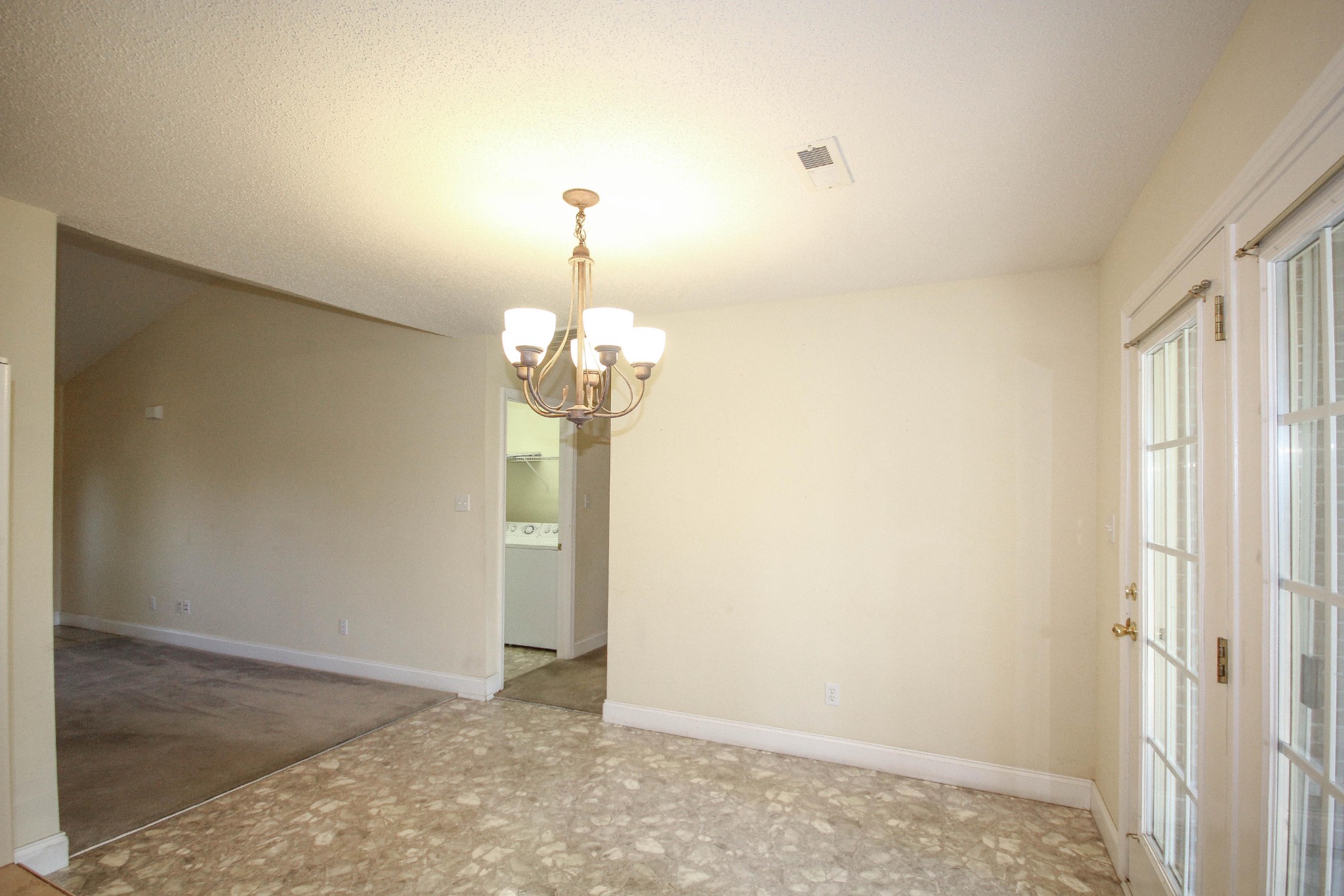 5510 J Riley W Drive Greenback, TN 37742 - Photo 19 of 40 a view of a room with a refrigerator wooden floor and chandelier