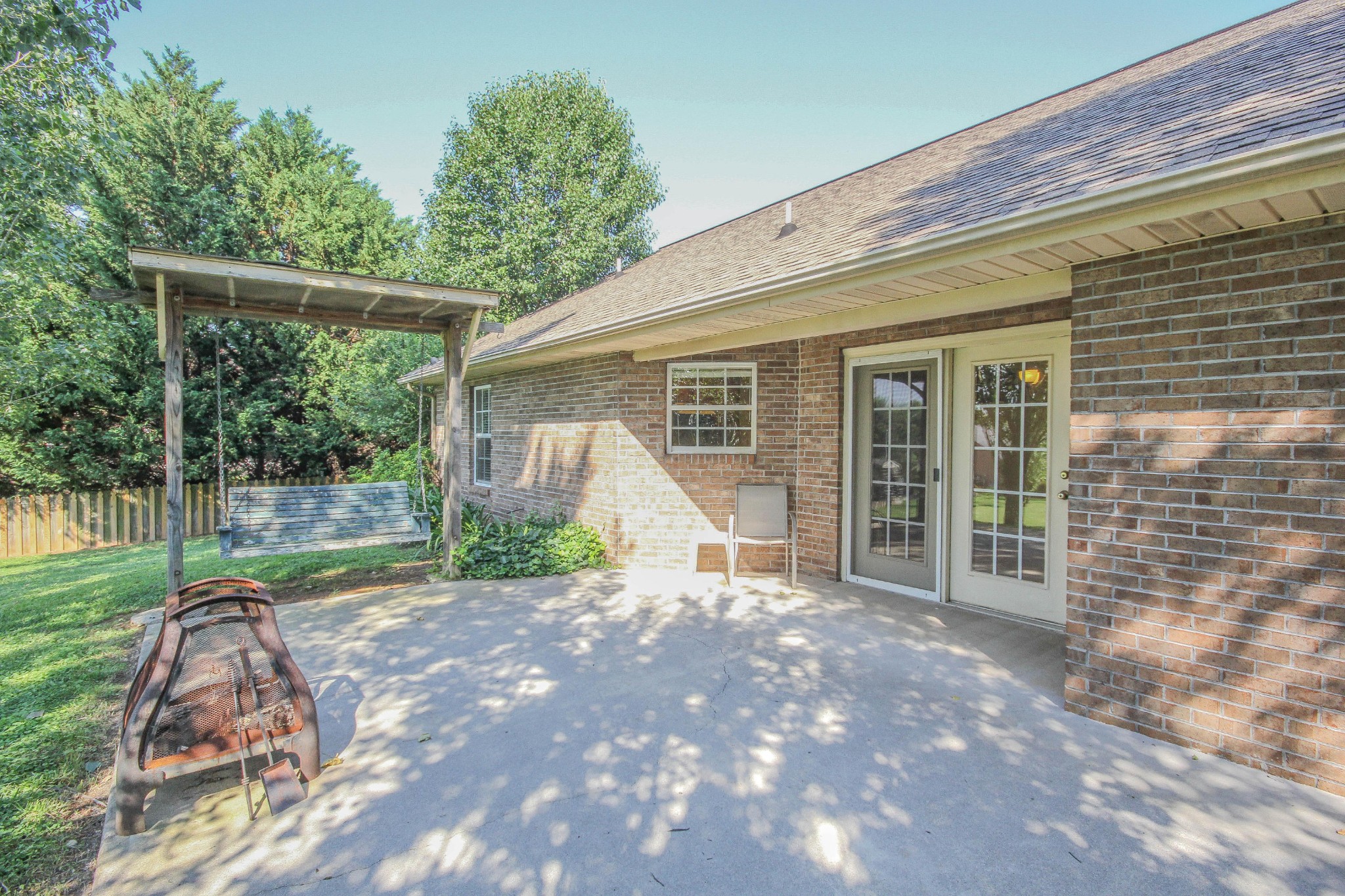 5510 J Riley W Drive Greenback, TN 37742 - Photo 5 of 40 a view of a backyard with floor to ceiling window and tree