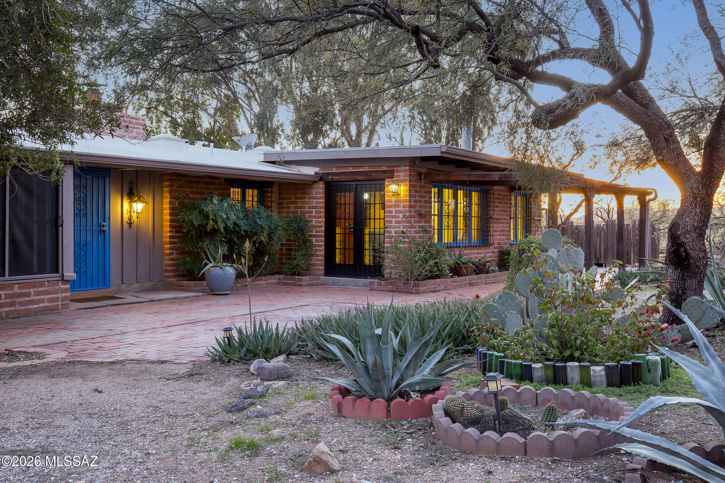 4130 East River Road Tucson, AZ 85718 - Photo 1 of 46 a front view of a house with garden