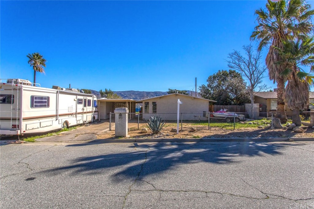 482 East Repplier Road Banning, CA 92220 - Photo 1 of 1 a front view of a house with basket ball court and outdoor seating