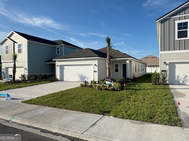 210 Collin Nicholas Drive Kingsland, GA 31548 - Photo 3 of 15 front view of a house with a yard