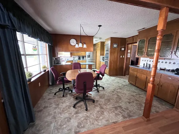 a view of a livingroom with furniture and a window