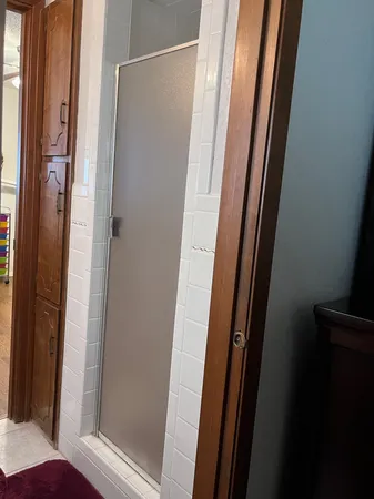 a bathroom with a glass door