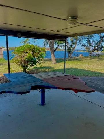 a view of yard with an outdoor seating