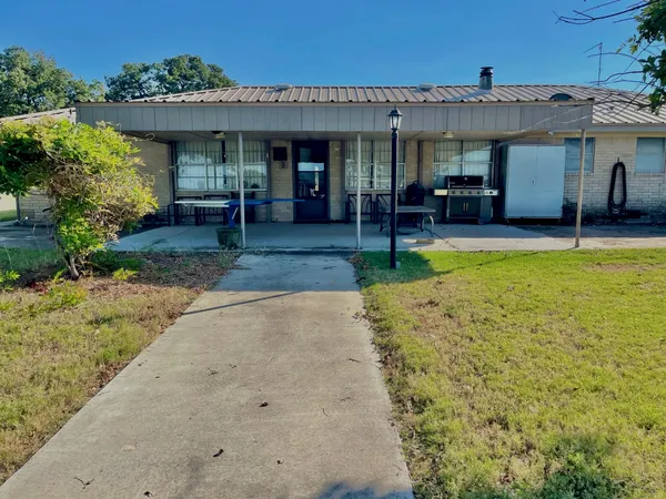 a view of a swimming pool with furniture