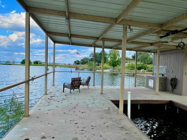 a view of a patio with a table chairs and a patio