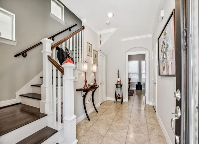 a view of entryway and hall with dining room