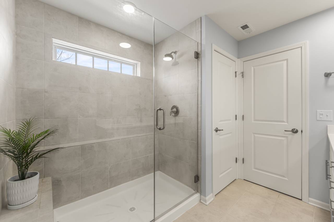 1241 Draper Road McHenry, IL 60050 - Photo 13 of 27 a bathroom with a shower and a sink