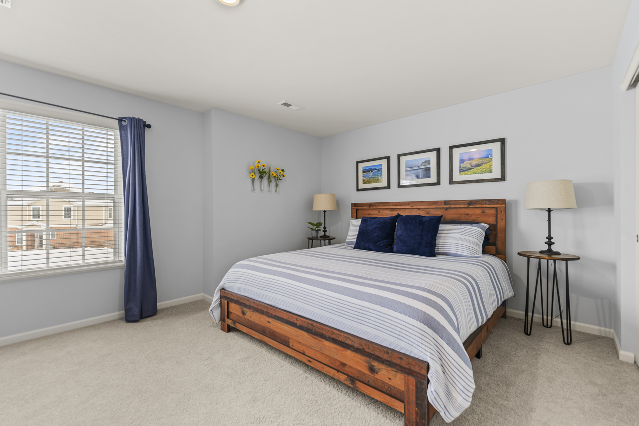 1241 Draper Road McHenry, IL 60050 - Photo 15 of 27 a spacious bedroom with a bed and a window