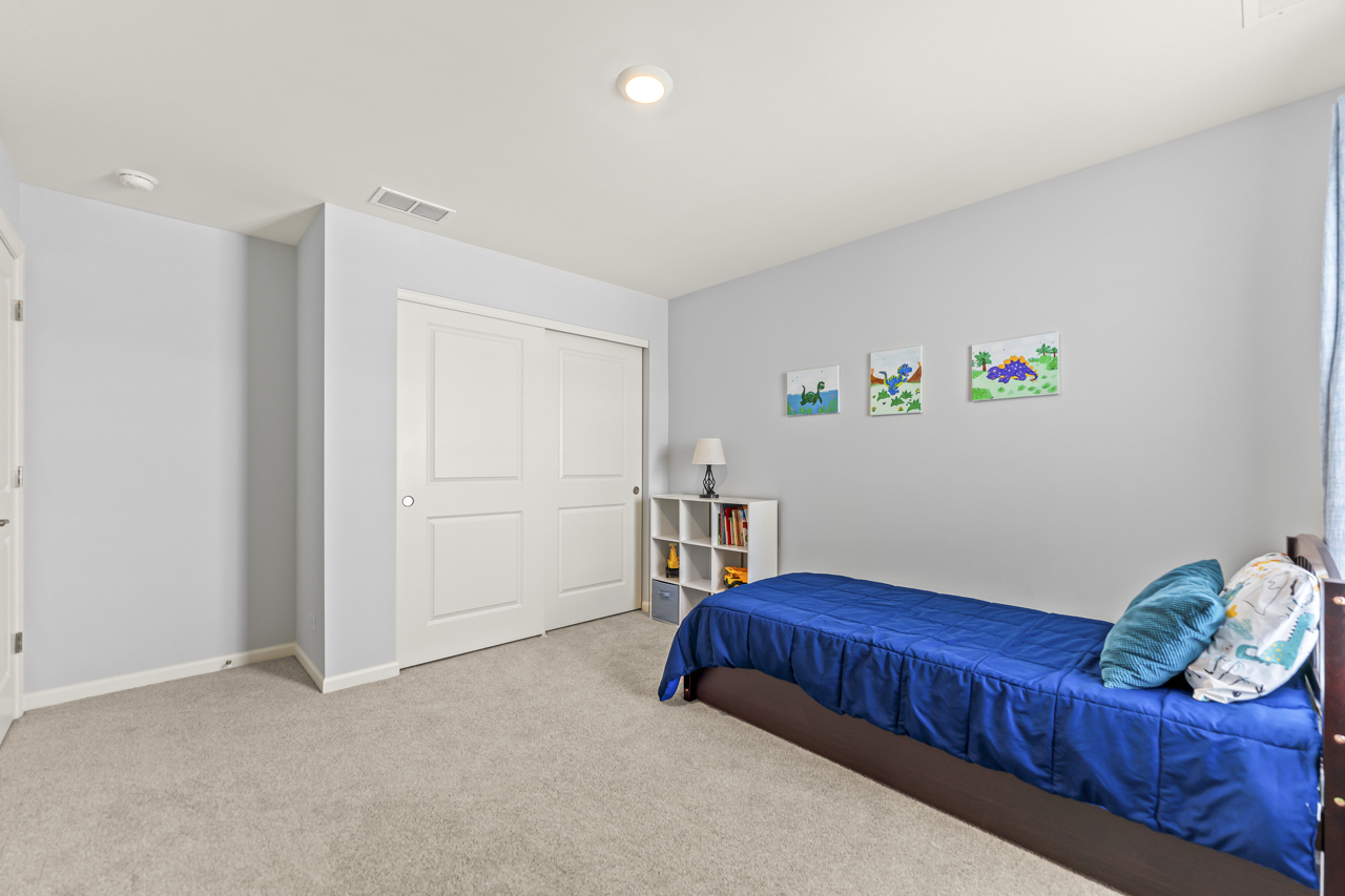 1241 Draper Road McHenry, IL 60050 - Photo 19 of 27 a bedroom with furniture and a window