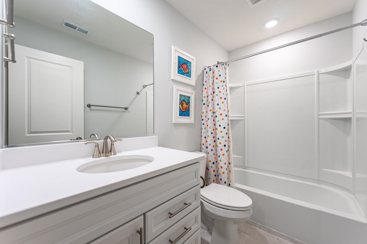 1241 Draper Road McHenry, IL 60050 - Photo 20 of 27 a bathroom with a sink a toilet and shower