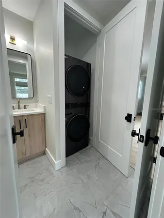 a view of a hallway with washer and dryer