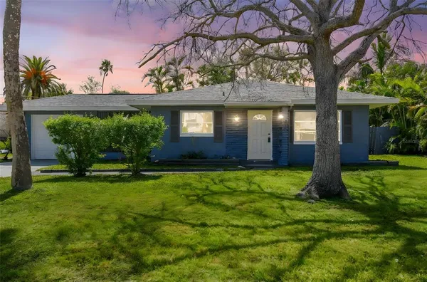 front view of a house with a yard