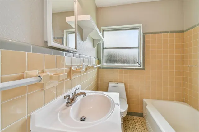 a bathroom with a sink and a bathtub