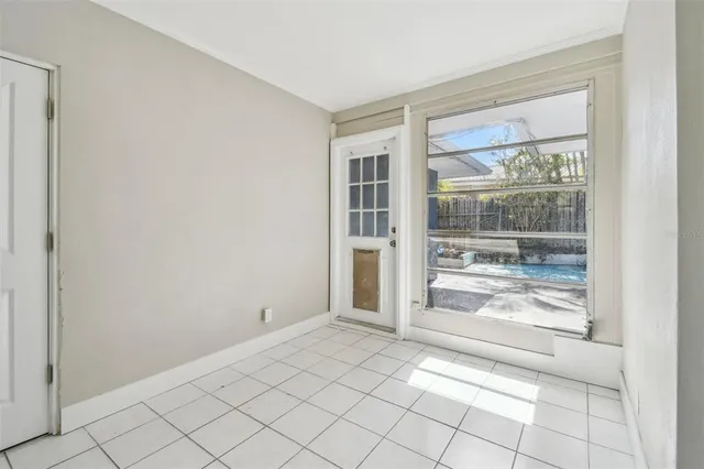 a view of an empty room and window