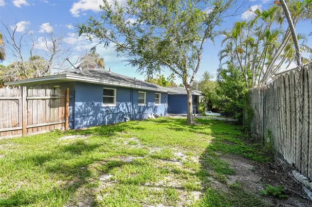a yellow house in middle of the forest