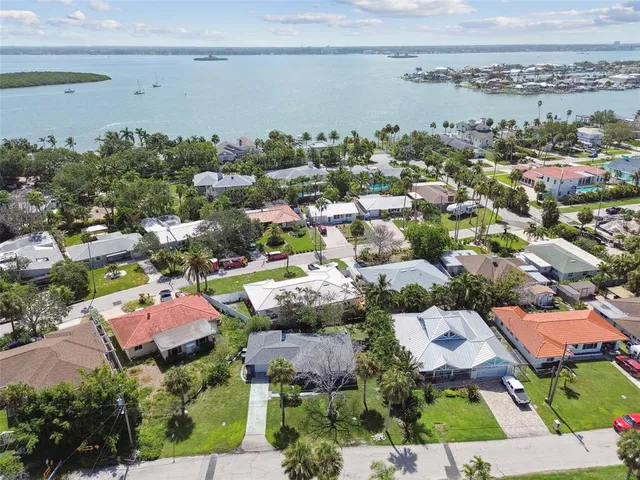 an aerial view of residential houses with city view