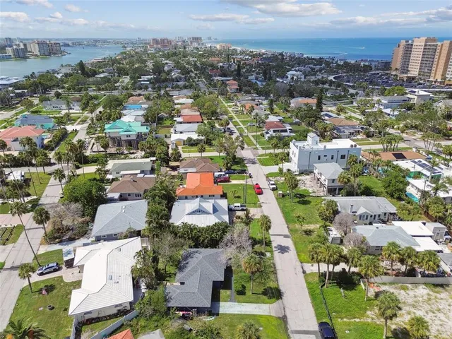 an aerial view of residential houses with city view