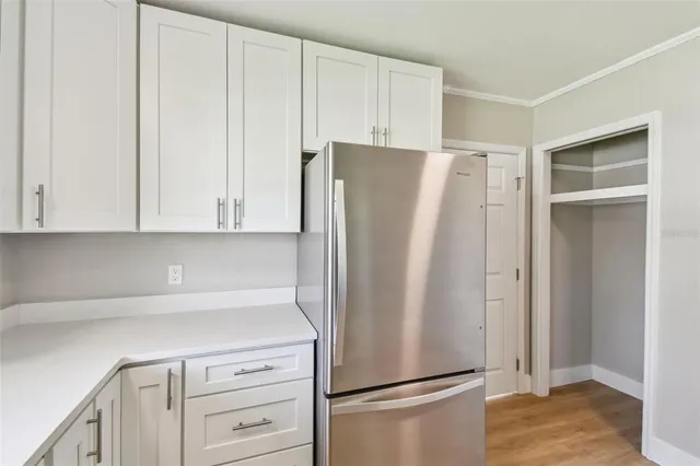 a white refrigerator freezer sitting in a kitchen
