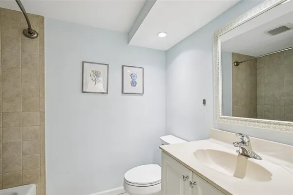 a bathroom with a sink toilet and vanity