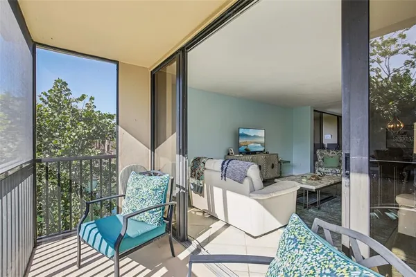 a bedroom with furniture and a potted plant