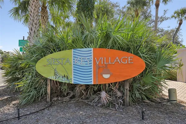 a view of a swimming pool with a table and chairs