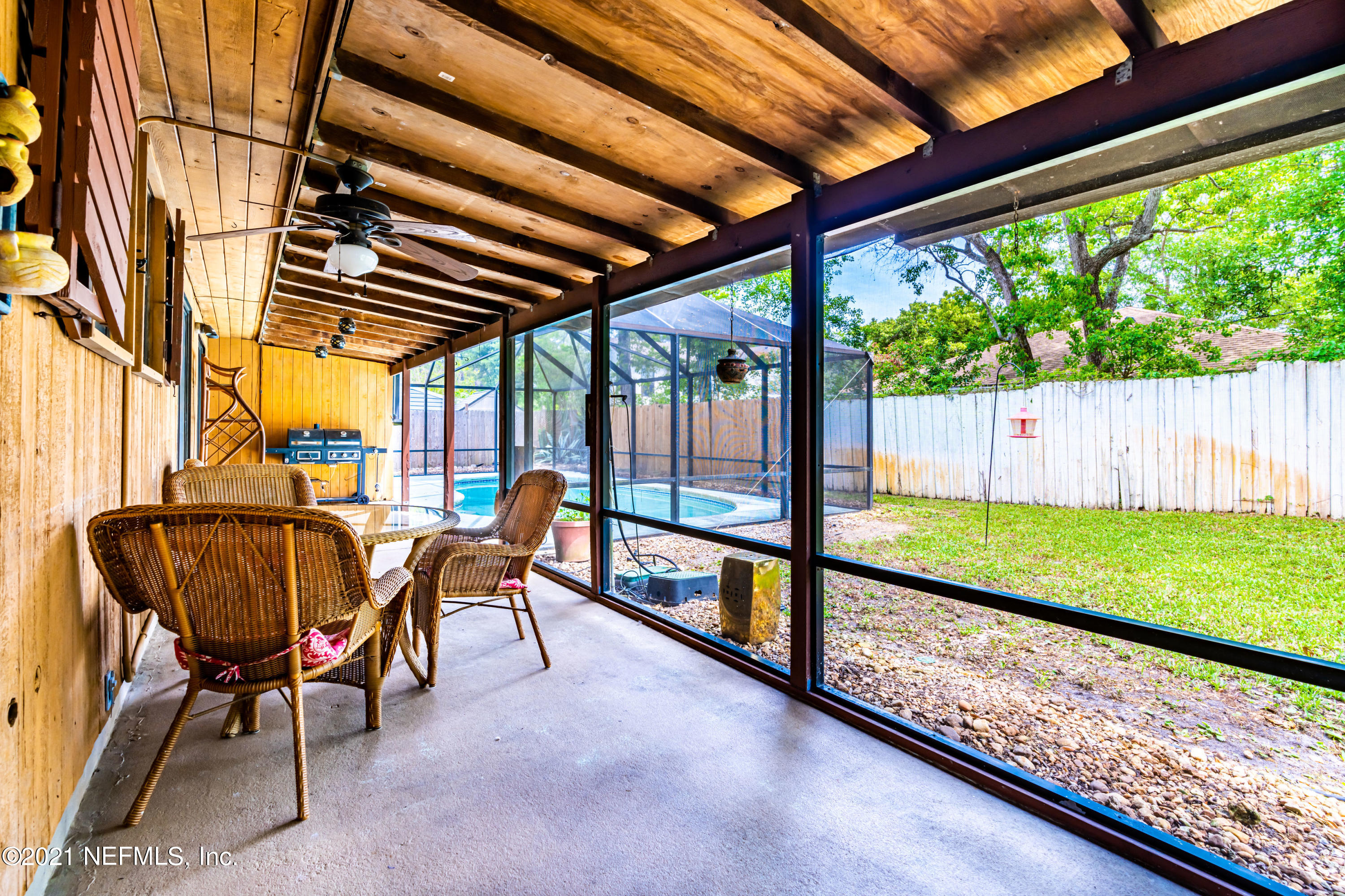 215 Harvard Road St. Augustine, FL 32086 - Photo 24 of 42 a view of chairs and table in the patio