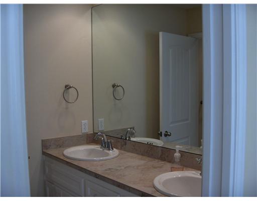 4017 Acushnet Drive Corpus Christi, TX 78413 - Photo 6 of 10 a bathroom with a granite countertop sink and a mirror