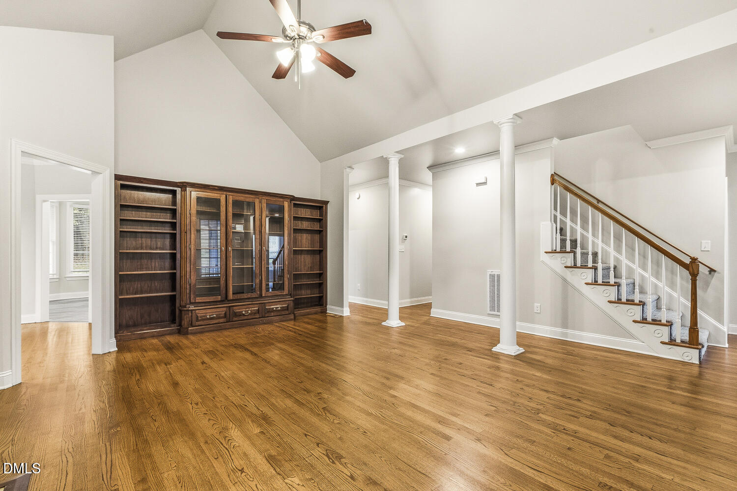 1006 Barnford Mill Road Wake Forest, NC 27587 - Photo 11 of 40 a view of an empty room with wooden floor and a window