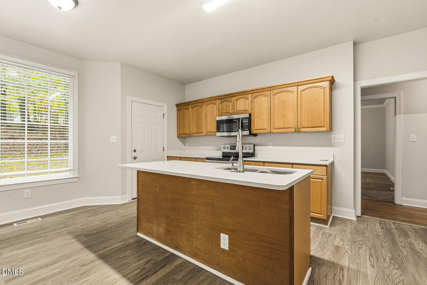 1006 Barnford Mill Road Wake Forest, NC 27587 - Photo 15 of 40 a kitchen with stainless steel appliances granite countertop a sink stove and cabinets