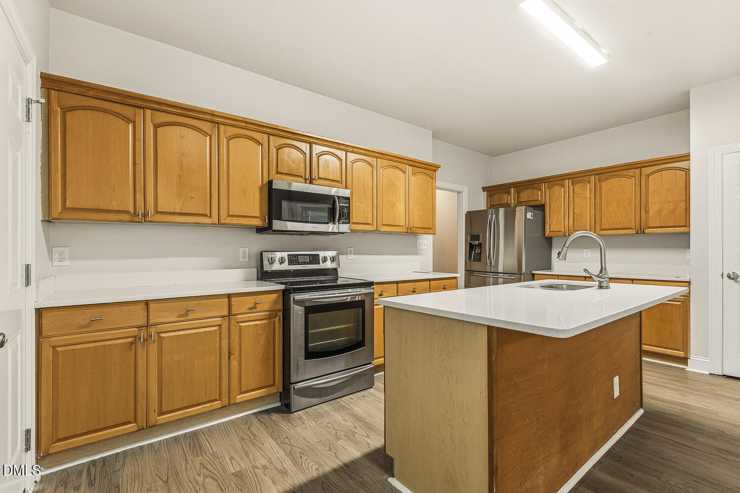 1006 Barnford Mill Road Wake Forest, NC 27587 - Photo 17 of 40 a kitchen with stainless steel appliances granite countertop a stove top oven a sink dishwasher and a refrigerator
