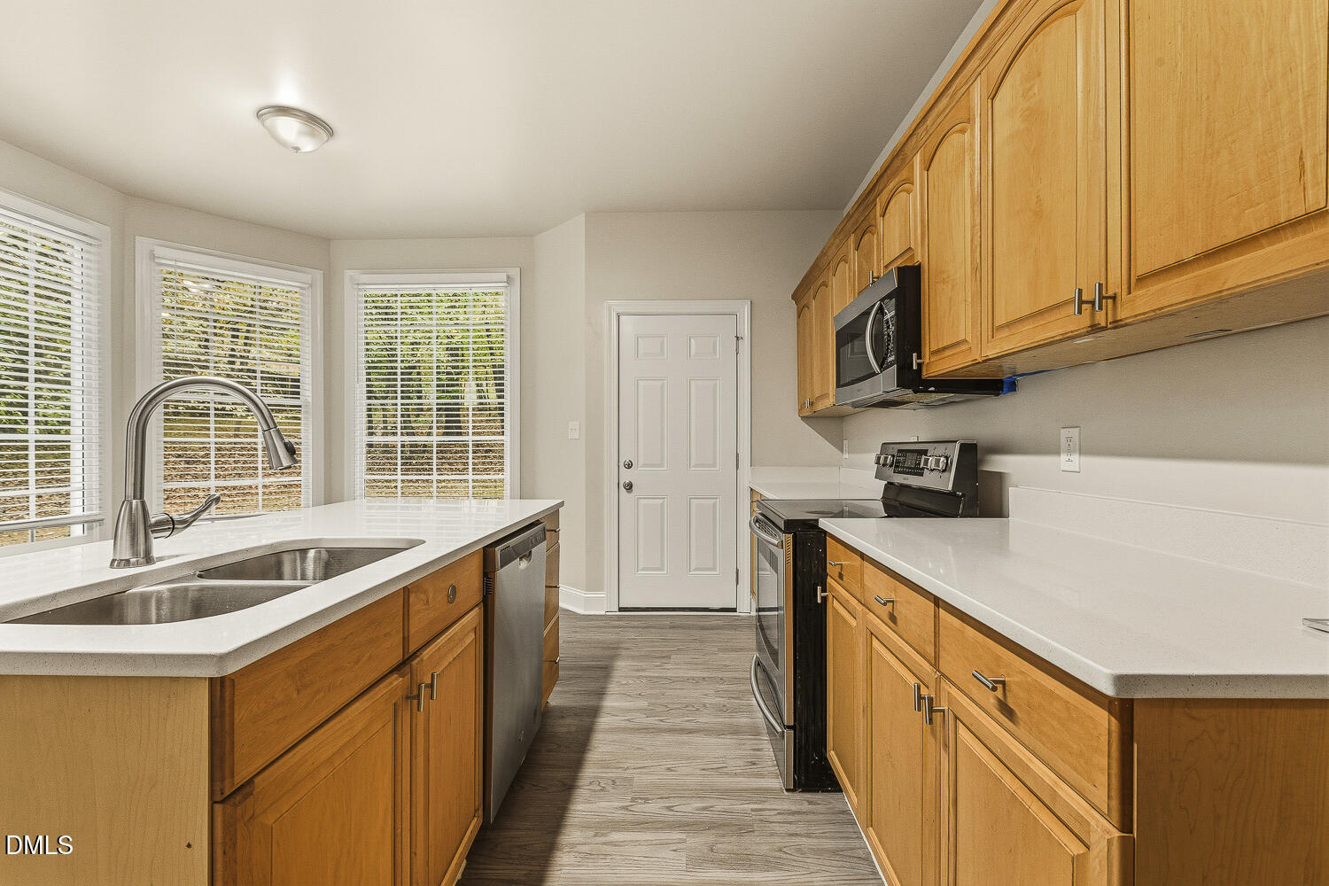 1006 Barnford Mill Road Wake Forest, NC 27587 - Photo 19 of 40 a kitchen that has a sink and a stove