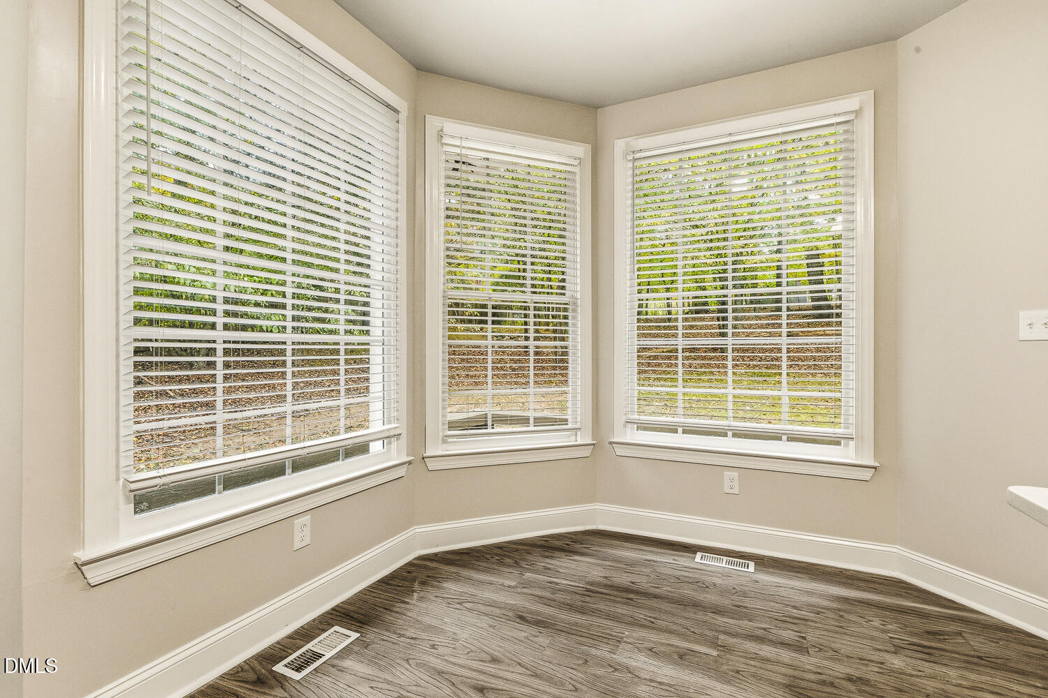 1006 Barnford Mill Road Wake Forest, NC 27587 - Photo 20 of 40 a view of an empty room with a window and wooden floor