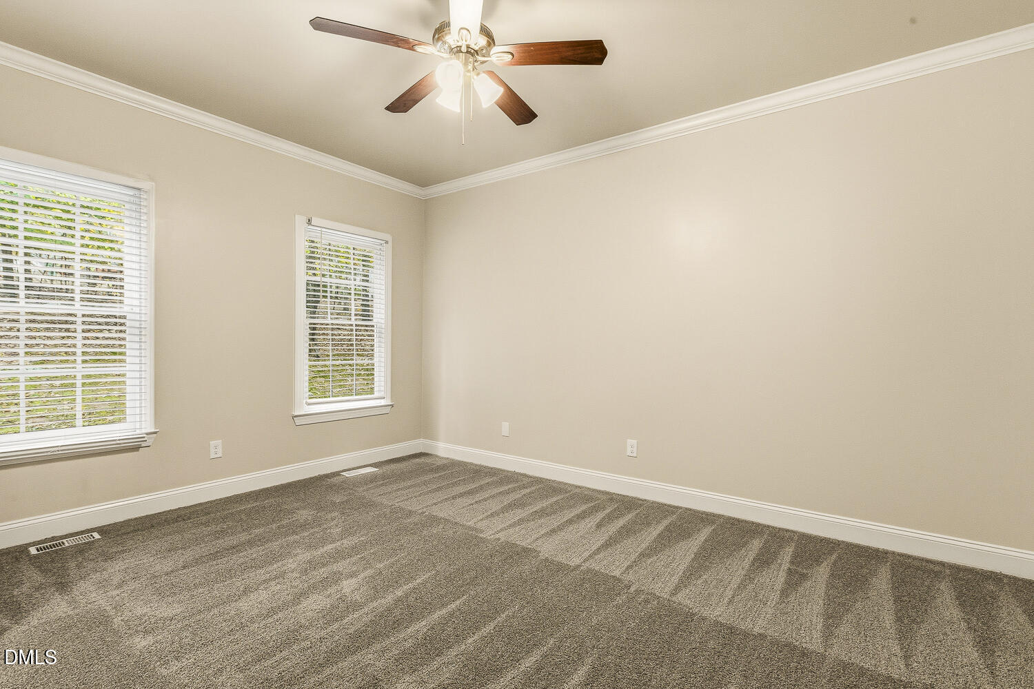 1006 Barnford Mill Road Wake Forest, NC 27587 - Photo 21 of 40 an empty room with windows and fan