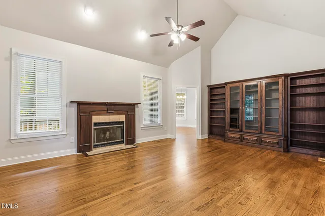 an entryway in a hall with a fireplace