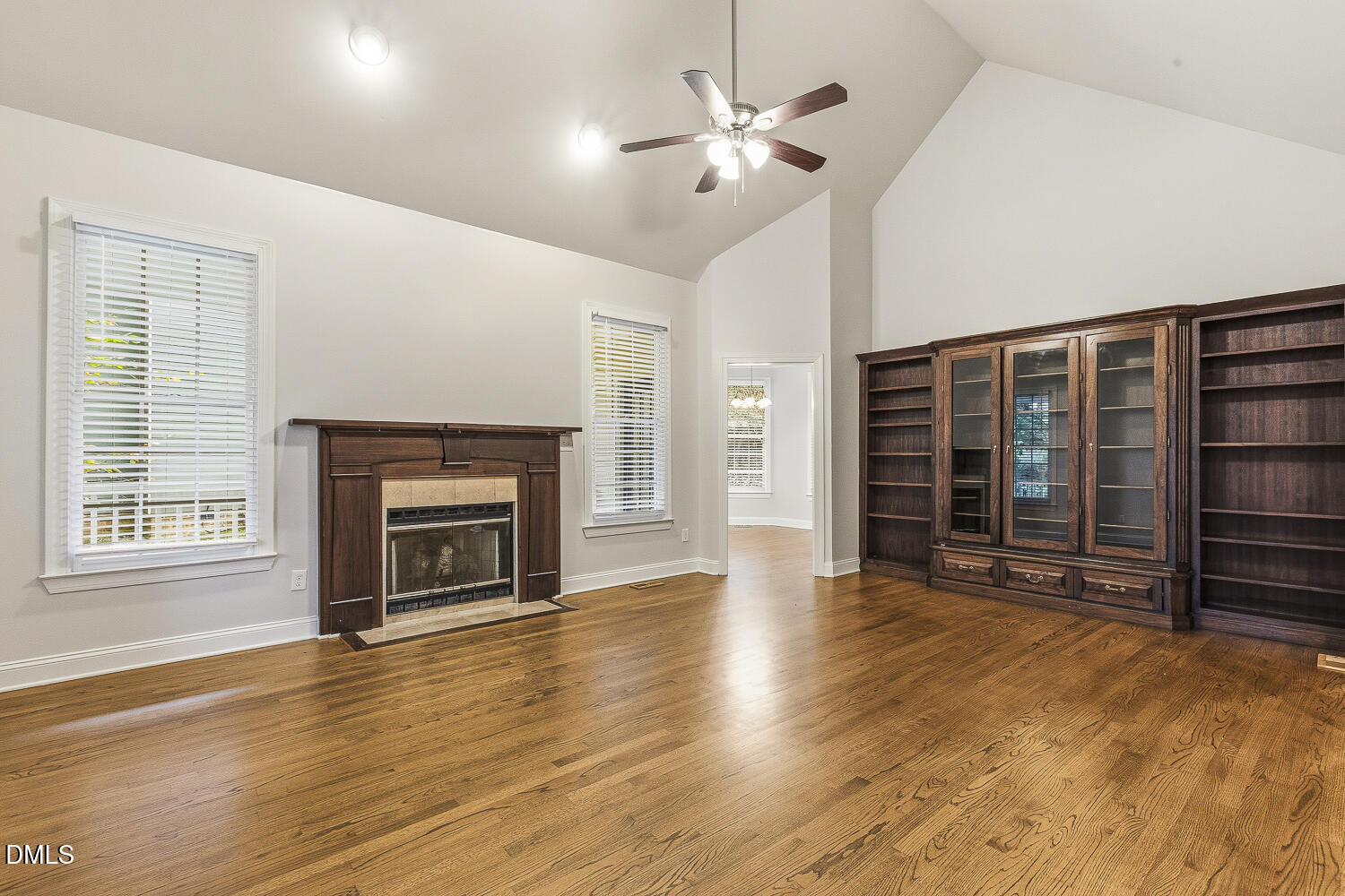 1006 Barnford Mill Road Wake Forest, NC 27587 - Photo 7 of 40 an empty room with windows cabinet and fireplace