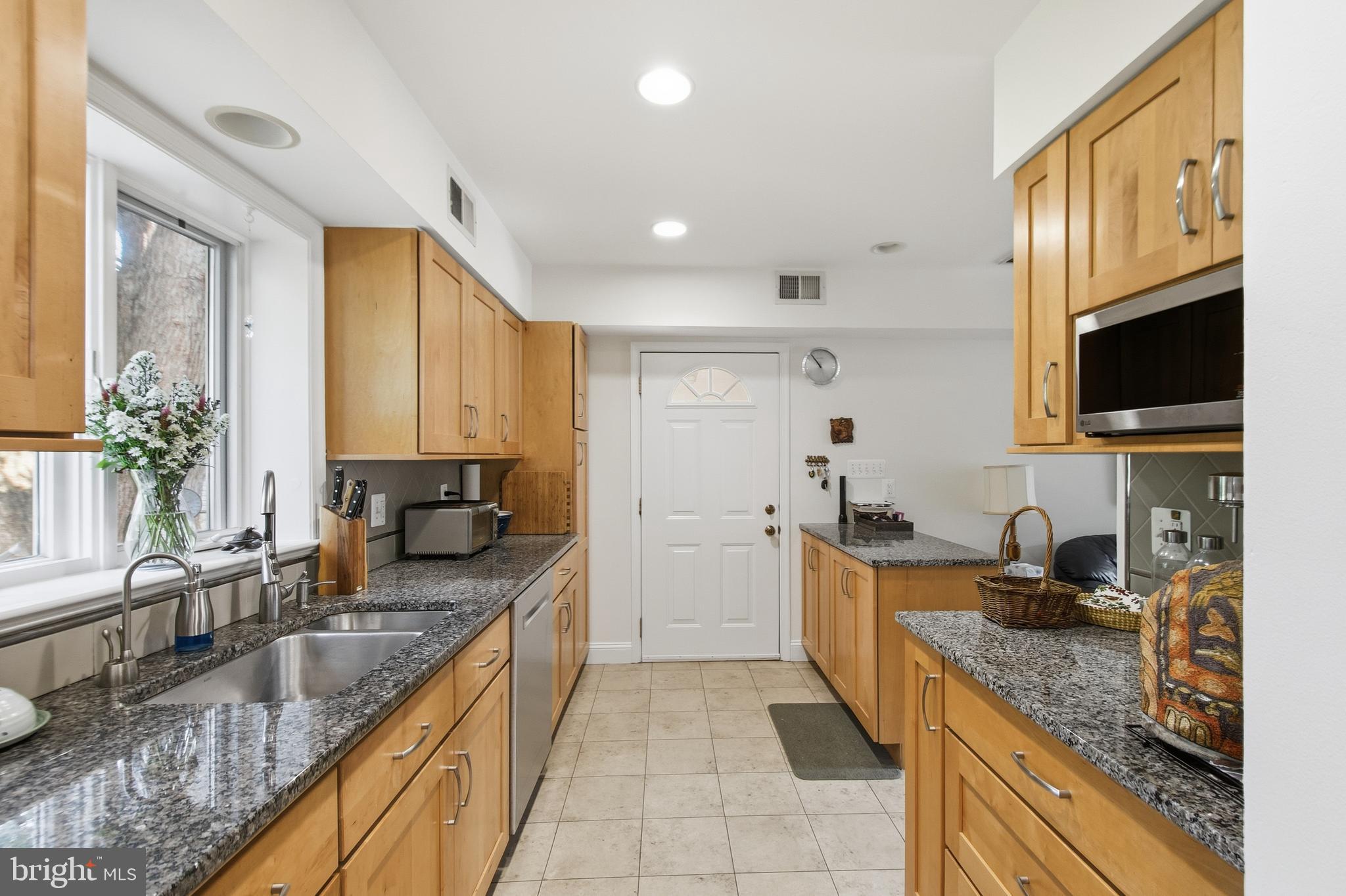 215 West George Mason Road Falls Church, VA 22046 - Photo 13 of 50 a kitchen with granite countertop lots of counter top space
