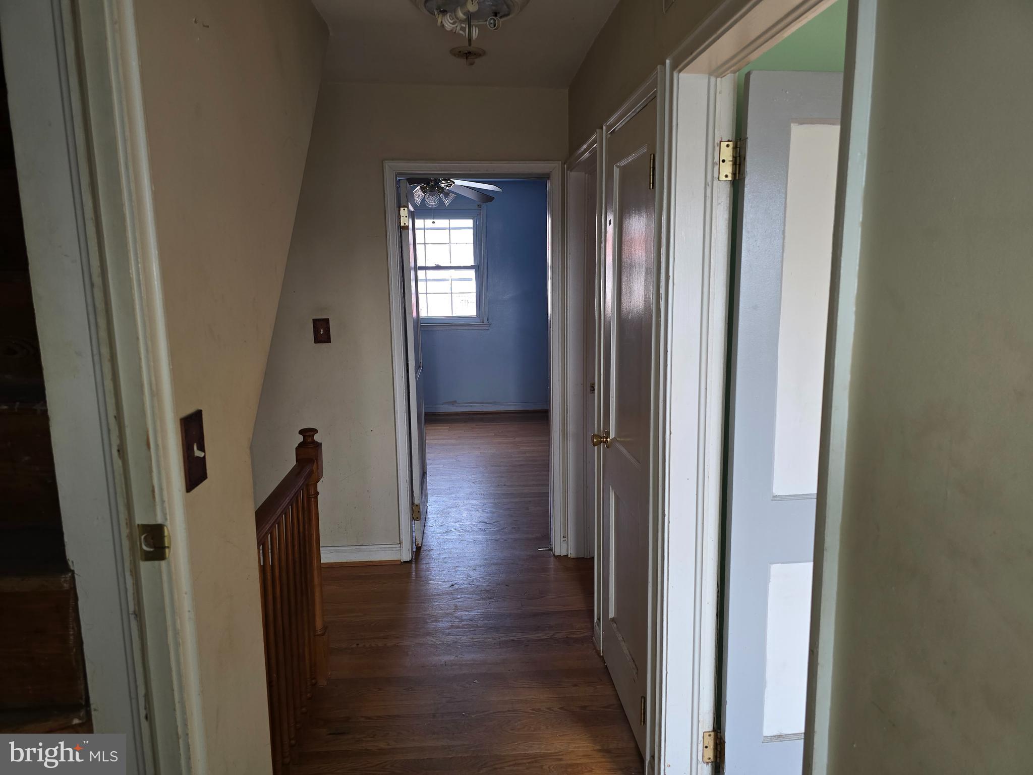 1708 Hartsdale Road Baltimore, MD 21239 - Photo 13 of 26 a view of a hallway with wooden floor and stairs