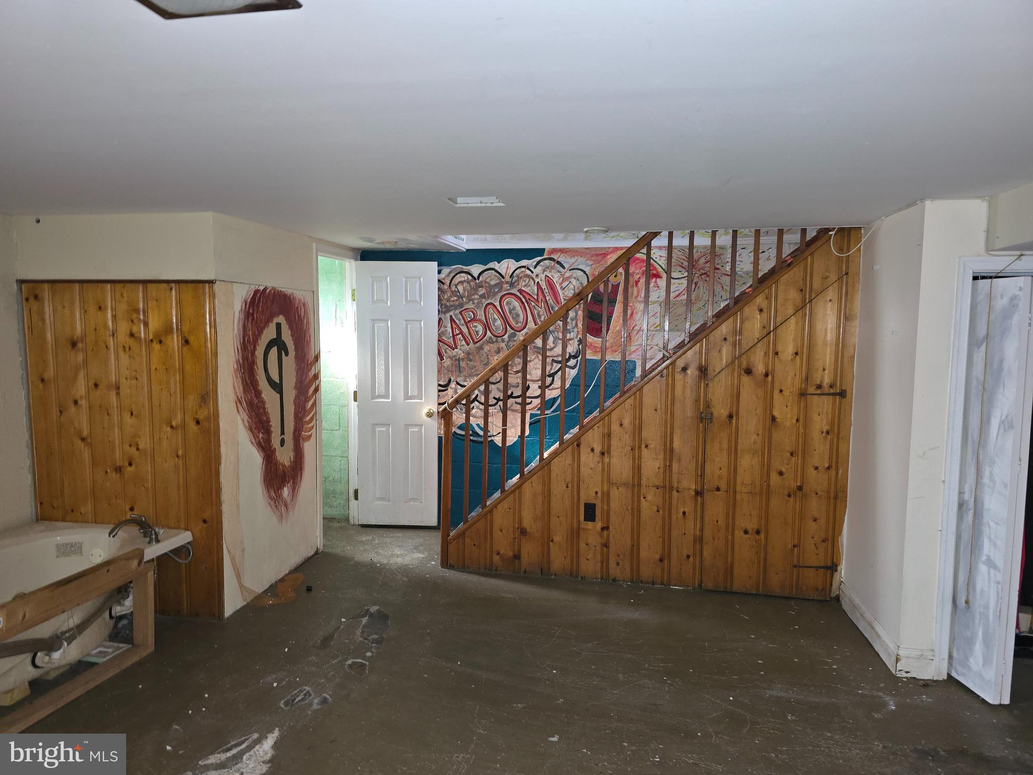 1708 Hartsdale Road Baltimore, MD 21239 - Photo 21 of 26 a view of a hallway with staircase