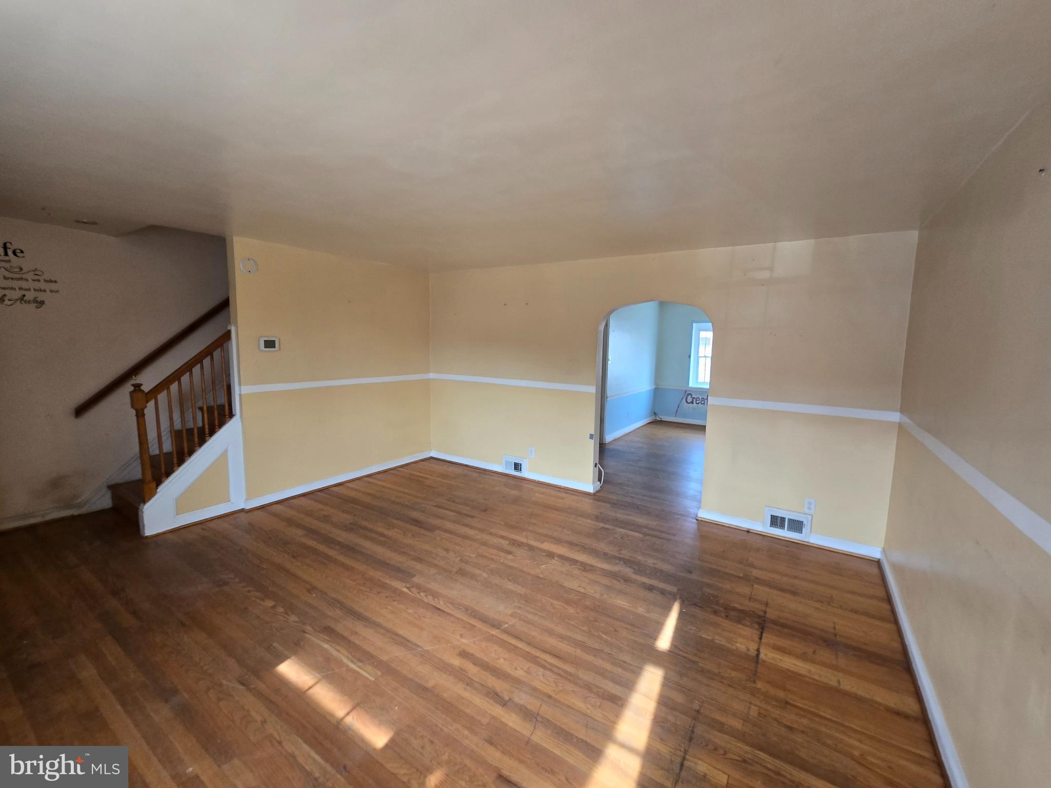 1708 Hartsdale Road Baltimore, MD 21239 - Photo 4 of 26 a view of empty room with wooden floor