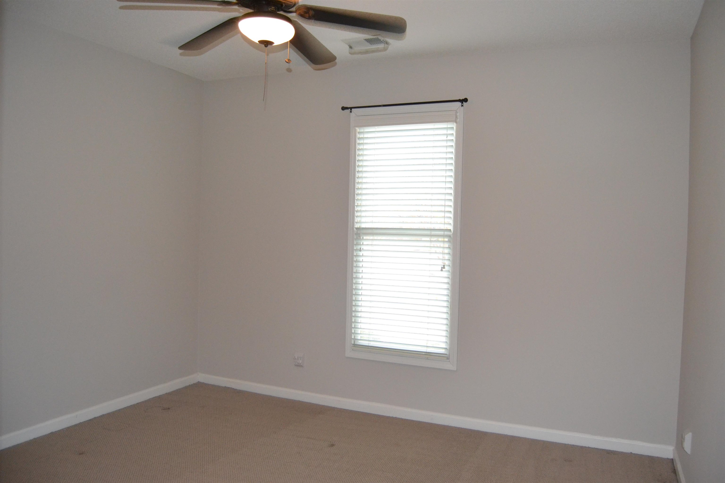 10486 Juneau Way Collierville, TN 38017 - Photo 22 of 33 Spare room with ceiling fan and light colored carpet