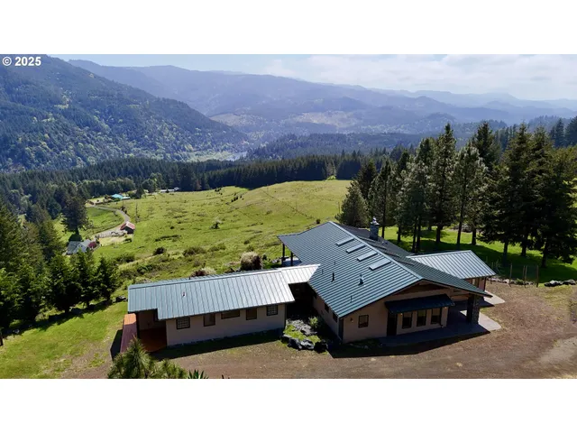 a wooden bench sitting in the middle of a field