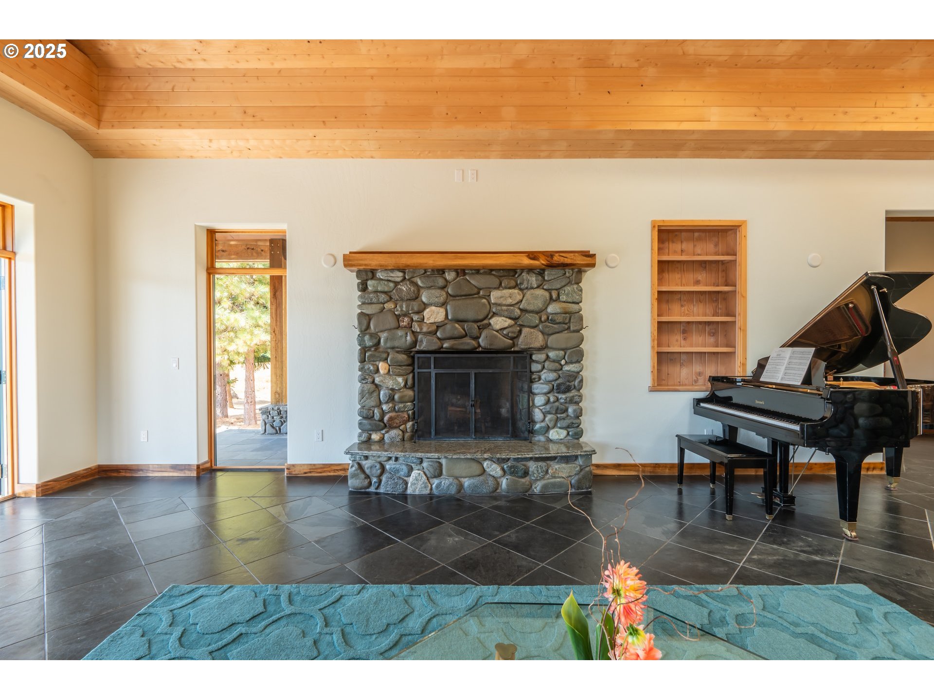 32855 Miller Ranch Road Gold Beach, OR 97444 - Photo 13 of 47 a living room with furniture and a fireplace