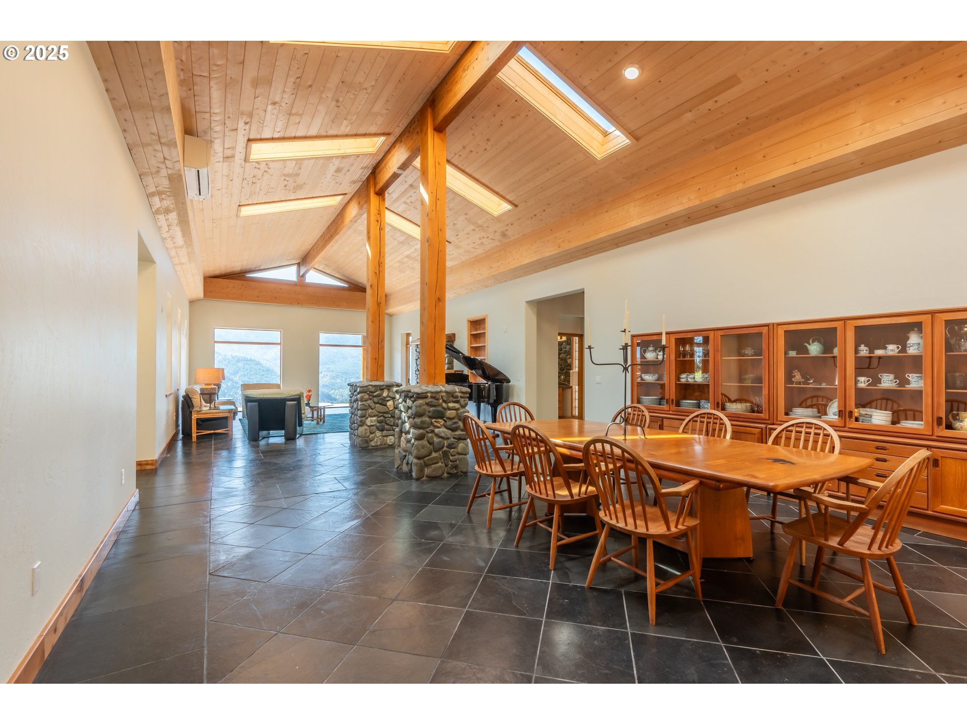 32855 Miller Ranch Road Gold Beach, OR 97444 - Photo 15 of 47 a dining room with furniture and wooden floor