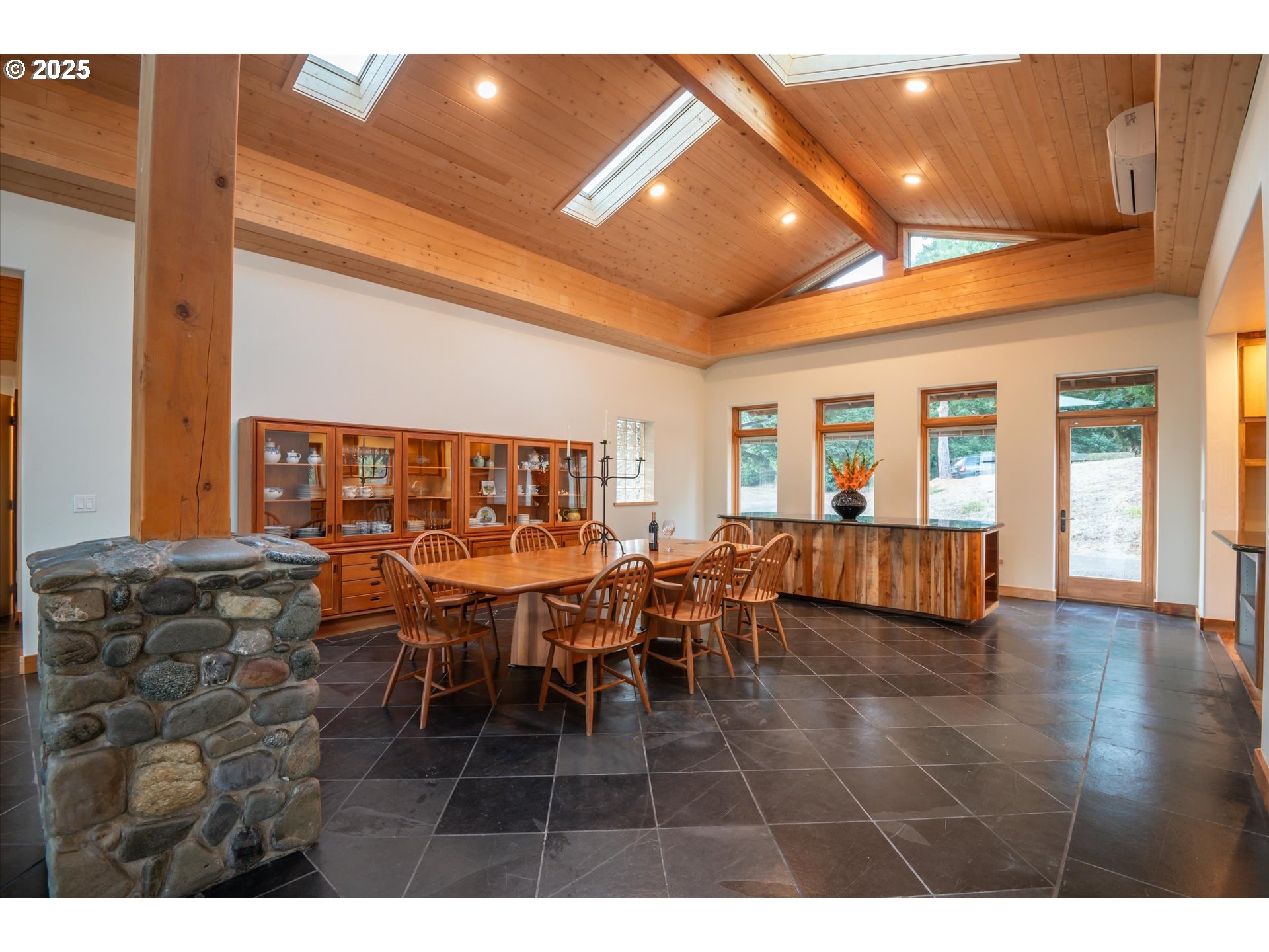 32855 Miller Ranch Road Gold Beach, OR 97444 - Photo 16 of 47 a view of a dining room with furniture and chandelier
