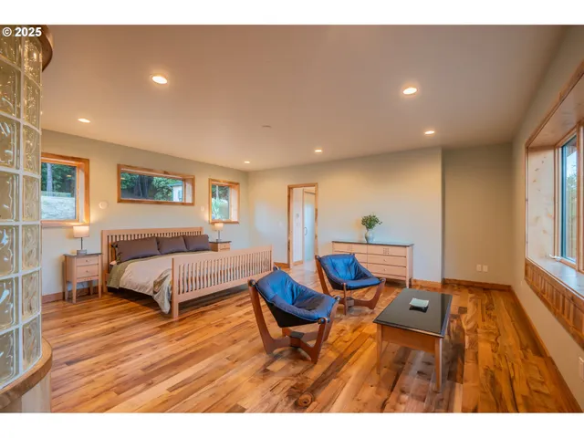 a view of a room with furniture and window