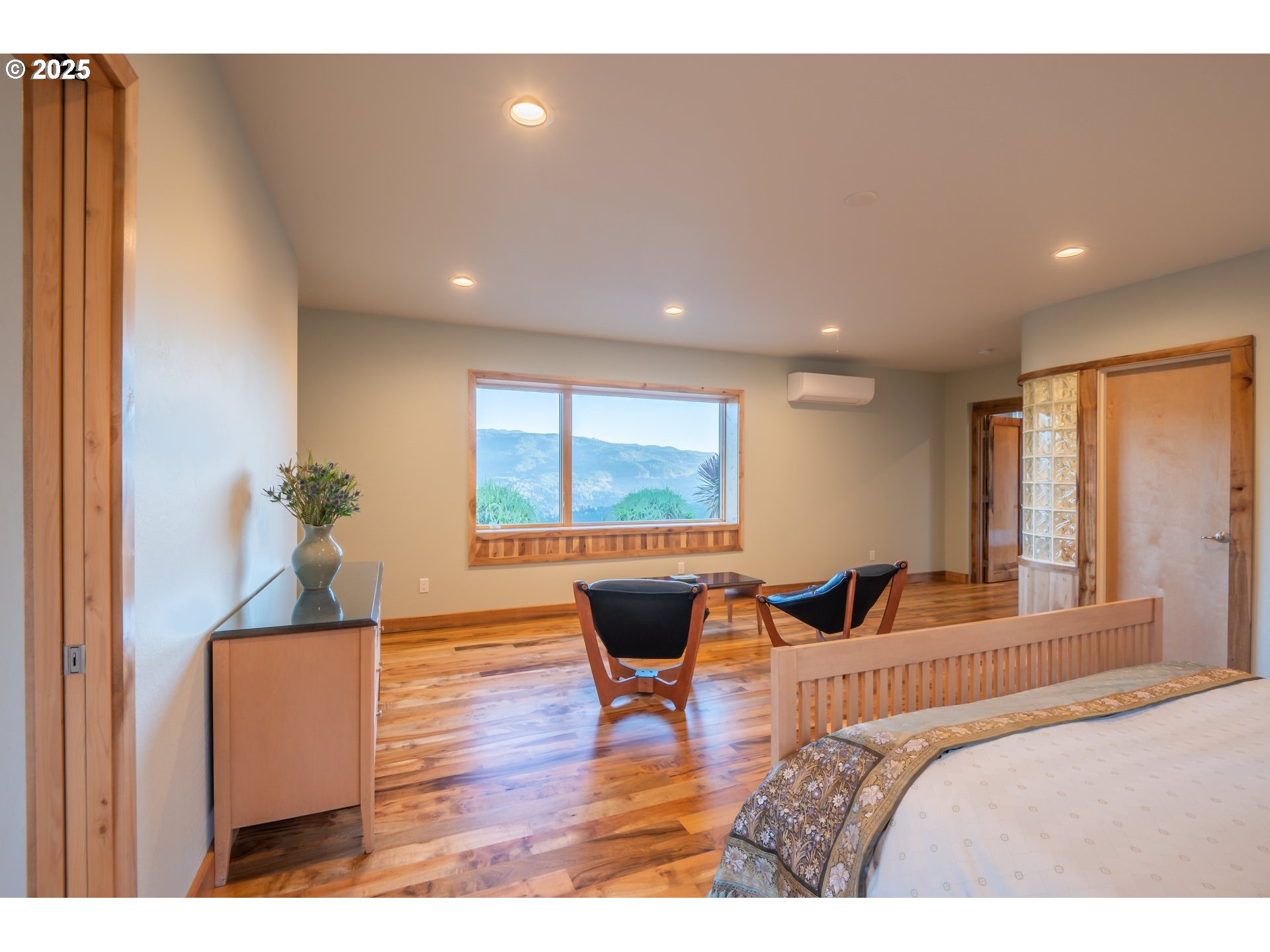 32855 Miller Ranch Road Gold Beach, OR 97444 - Photo 28 of 47 a bedroom with a bed and wooden floor