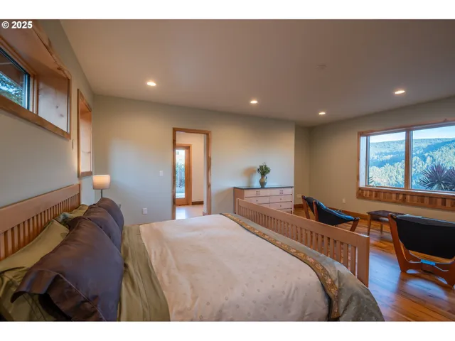 a spacious bathroom with a tub and a large mirror