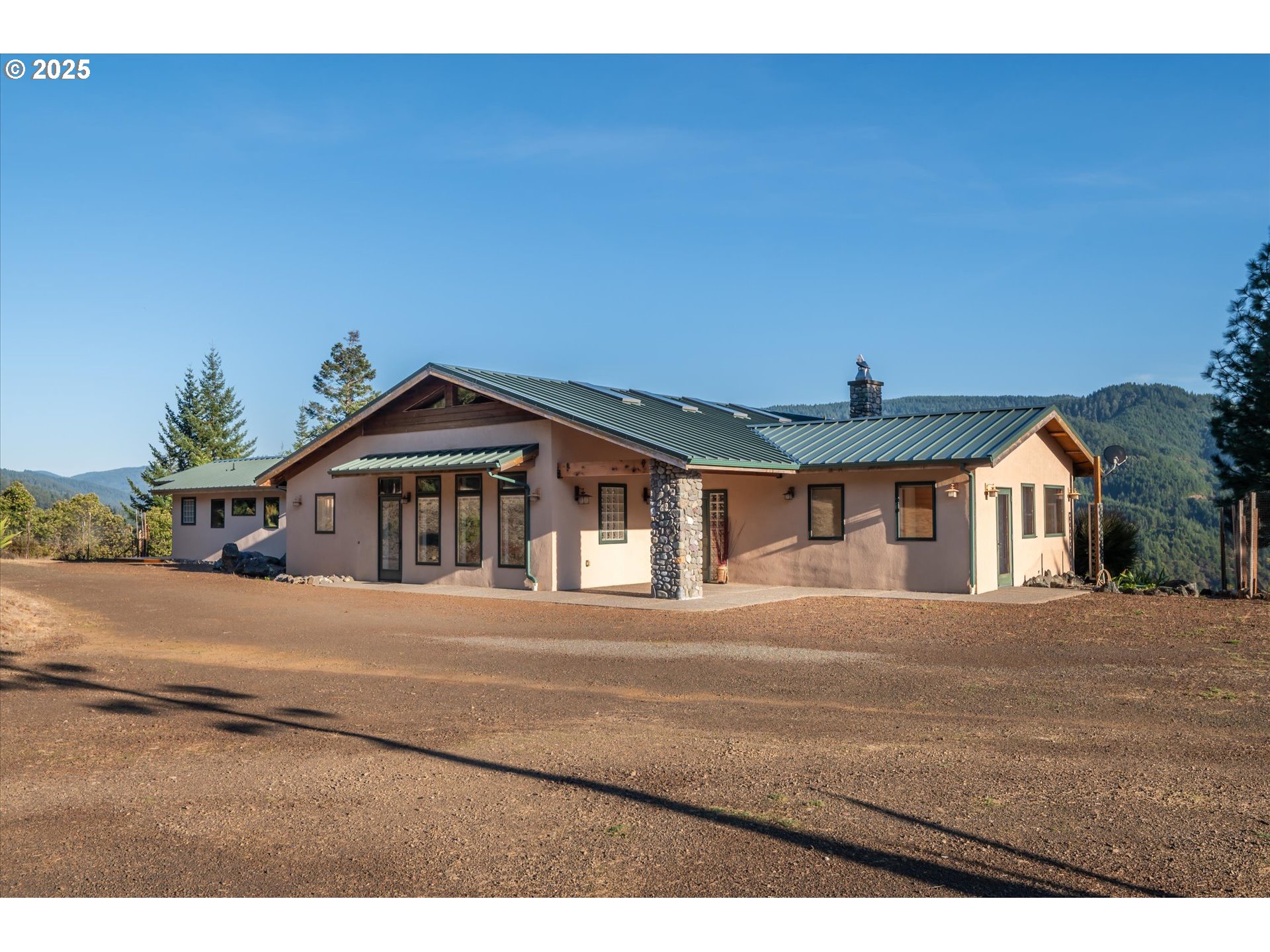 32855 Miller Ranch Road Gold Beach, OR 97444 - Photo 32 of 47 a front view of a house with a yard