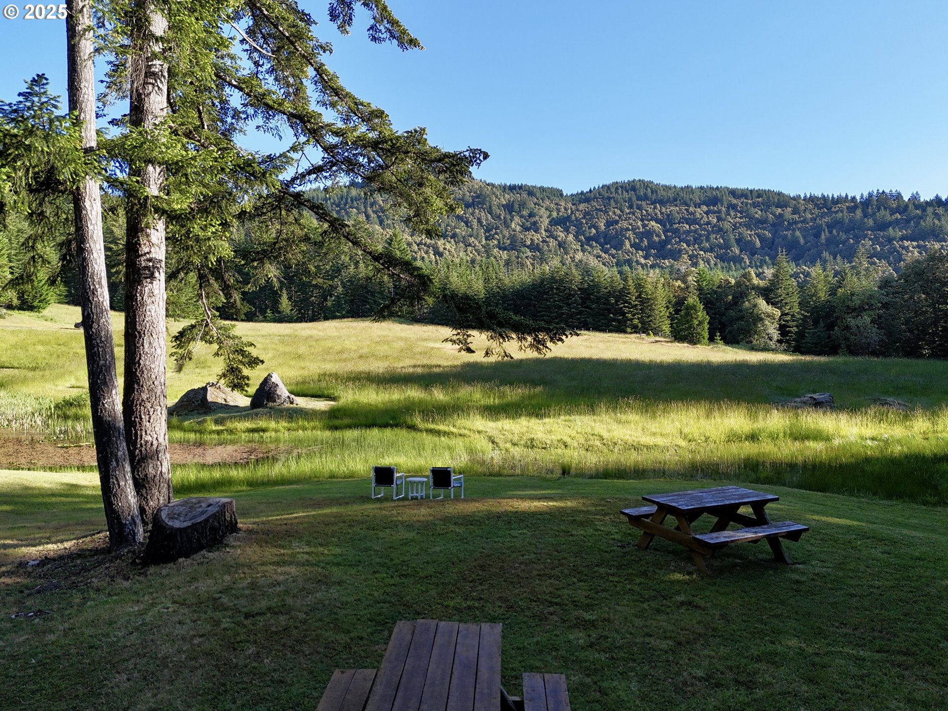 32855 Miller Ranch Road Gold Beach, OR 97444 - Photo 37 of 47 a view of a lake with a mountain
